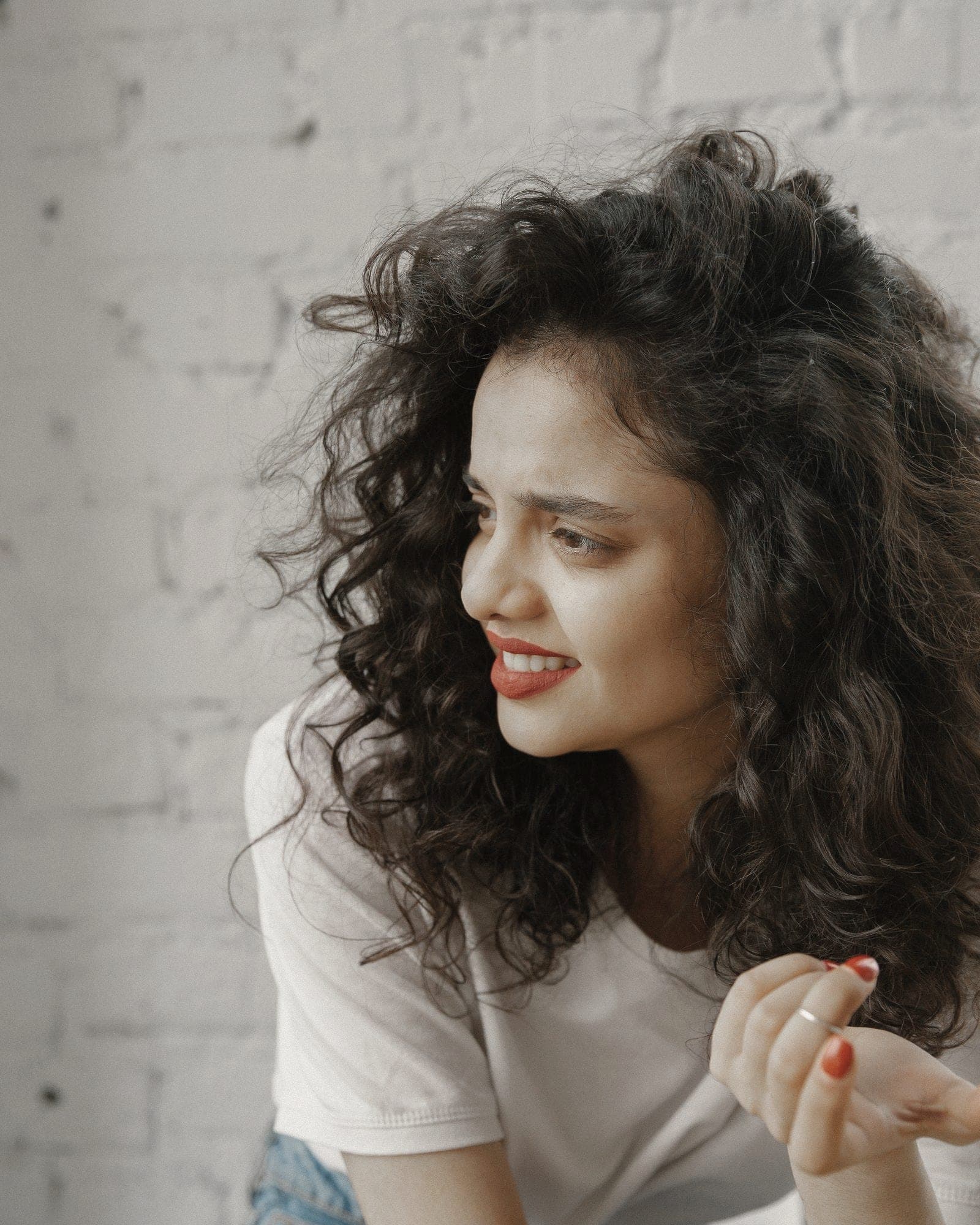 A model in a white boxy tee