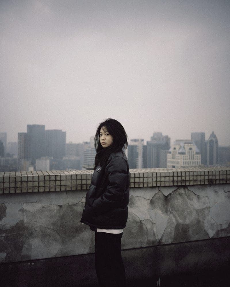 A model in a black quilted liner jacket