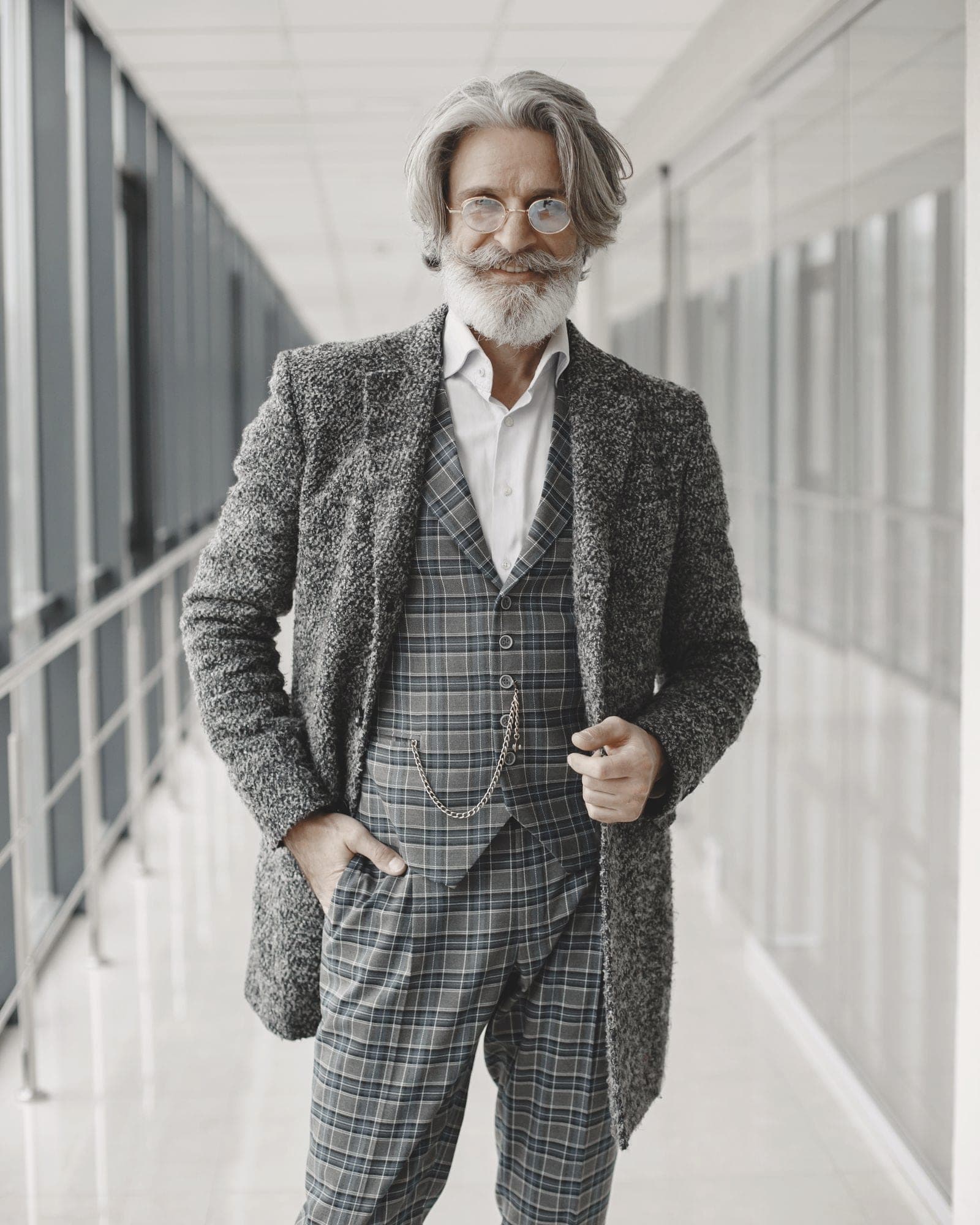 A man in a charcoal wool overcoat